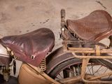 a old motorcycle that is sitting in the garage