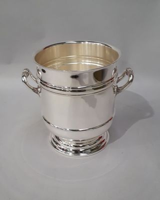 silver plated ice bucket with handles and handles on a white background