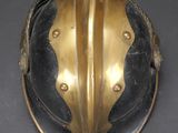 a gold helmet on a black table