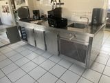 a large stainless steel counter in a commercial kitchen
