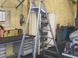 a ladder that is standing up in a room