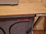 a laptop sitting on top of a table with a laptop on it