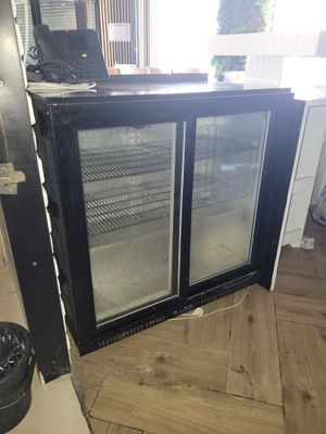 an image of a kitchen with a refrigerator in it