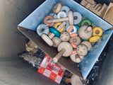 a box full of wooden toys in the back seat of a car