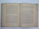 an open book on a white table with a white background
