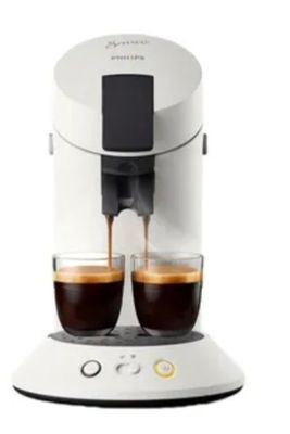 a close up of two cups of coffee being poured into a coffee machine