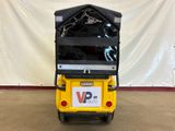 a small yellow cart with a black cover on top of it