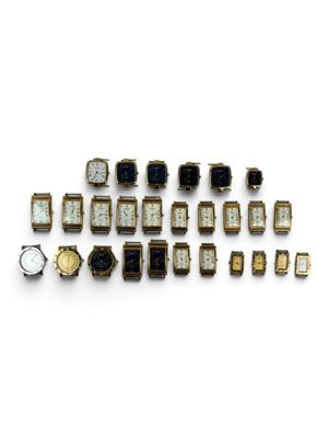 an image of a group of watches sitting on top of a white surface
