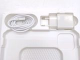 a white tray with a charger and a charger on it