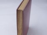 a book that is sitting on a white surface