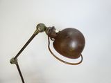 a lamp that is sitting on a table next to a wall