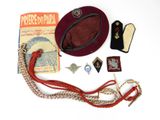 a red hat and other items that are on a table