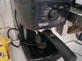 a coffee maker sitting on a counter in a kitchen