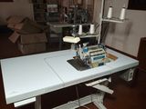 a sewing machine sitting on a table in a room