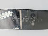 a close up of a knife with writing on it