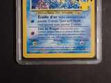 a pokemon card in a plastic container on a table