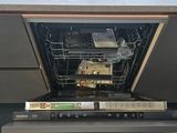 a dishwasher that is open in a kitchen