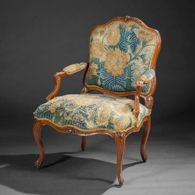 an antique chair with floral upholstered upholstered upholstered upholstered upholstered upholstered upholstered upholstered upholstered