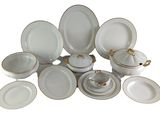 a picture of a collection of white and gold dinnerware
