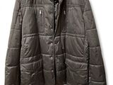 jacket on a hanger on a white wall with a white background