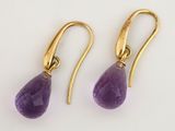 a pair of amethorate earrings with gold hooks