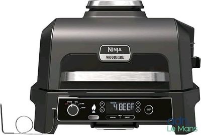 une image représentant un barbecue sur lequel figure une horloge numérique
