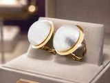 a pair of cufflinks that are on display in a jewelry store