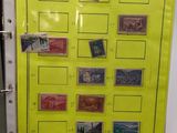 a yellow binder with stamps on it next to a binder