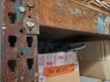 boxes are stacked on top of a shelf in a room