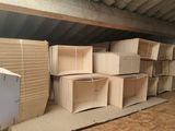 many cardboard boxes stacked on top of each other in a room