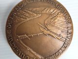 an image of a bronze medal with a bird on it
