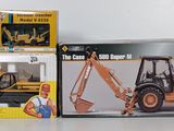 two boxes of construction toys sitting on a table