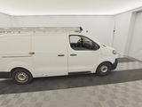 a picture of a white van parked in a garage