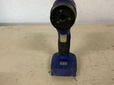 a close up of a drill on a table in a room