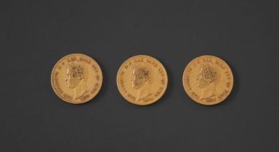 three gold sovereigns, one of which is a sovereign and the other of which is a sovereign
