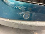 a close up of a car ' s bumper with rust on it