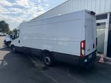 a white van parked in front of a building
