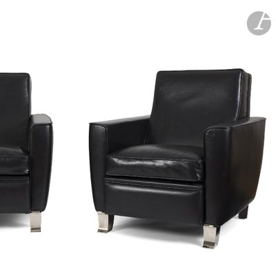 pair of black leather club chairs with chrome legs