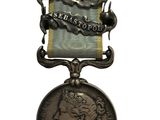 une image représentant une médaille sur laquelle figure le visage d'une femme