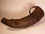 a wooden boat that is sitting on a white surface