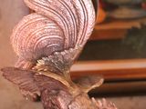 a statue of a bird that is sitting on a table