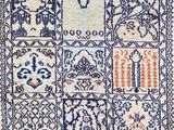 a blue and white rug with an oriental design on it