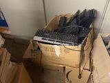 many boxes of umbrellas and boxes of other items in a room