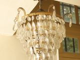 a chandelier hanging from the ceiling in a room