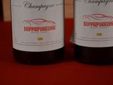 two bottles of wine that are on a table