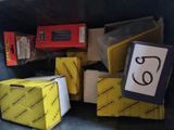a pile of boxes in a trash can with a number on it