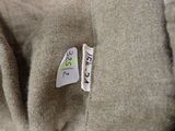 a close up of a piece of clothing with a tag on it