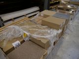 many boxes that are sitting on a pallet in a warehouse