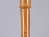 an old wooden pepper mill sitting on top of a table