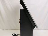a laptop that is sitting on a stand with a power cord